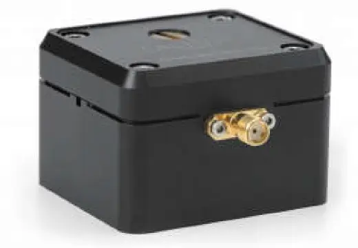 A black box with a gold connector

Description automatically generated